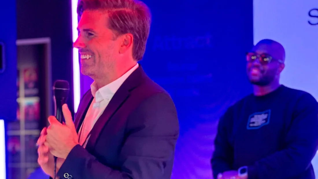 Adway speaker presenting on stage at a company event
